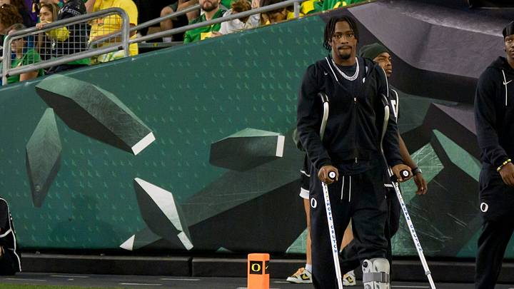 Oregon wide receiver Jeremiah McClellan walks on the field in a boot as the Oregon Ducks host the Portland State Vikings on Sept. 18, 2026, at Autzen Stadium in Eugene, Oregon.