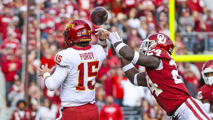 Nov 20, 2021; Norman, Oklahoma, USA; Oklahoma Sooners linebacker Brian Asamoah (24) causes Iowa State Cyclones quarterback Brock Purdy (15) to fumble during the second quarter at Gaylord Family-Oklahoma Memorial Stadium. Mandatory Credit: Kevin Jairaj-Imagn Images Nov 20, 2021; Norman, Oklahoma, USA; Oklahoma Sooners linebacker Brian Asamoah (24) causes Iowa State Cyclones quarterback Brock Purdy (15) to fumble during the second quarter at Gaylord Family-Oklahoma Memorial Stadium. Mandatory Credit: Kevin Jairaj-Imagn Images