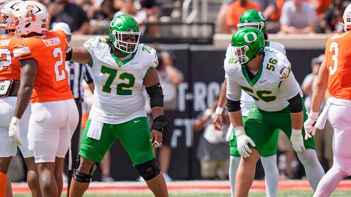 Oregon offensive lineman Trent Ferguson, right, and Oregon offensive lineman Iapani Laloulu line up as the Oregon Ducks face the Oklahoma State Cowboys on Sept. 12, 2026, at Boone Pickens Stadium in Stillwater, Oklahoma.