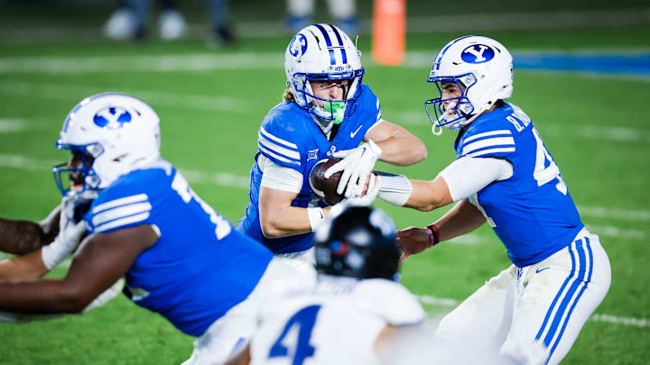 BYU QB Bear Bachmeier hands it off to Parker Kingston against TCU