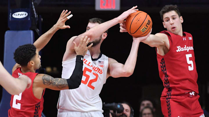 Feb 10, 2026; Champaign, Illinois, USA;  Wisconsin Badgers guard Nick Boyd (2) and Jack Janicki (5) pressure Illinois Fighting Illini center Tomislav Ivisic (52) during the second half at State Farm Center. Mandatory Credit: Ron Johnson-Imagn Images