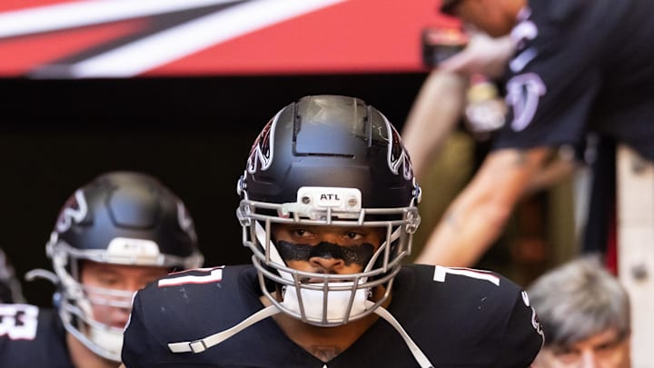 Dec 21, 2025; Glendale, Arizona, USA; Atlanta Falcons offensive lineman Elijah Wilkinson (71) against the Arizona Cardinals at State Farm Stadium. Mandatory Credit: Mark J. Rebilas-Imagn Images