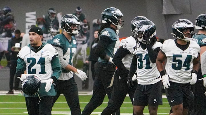 Eagles safety Sydney Brown (21) and linebacker Jeremiah Trotter Jr. (54) join other members of the defense as the Philadelphia Eagles work out in preparation for the Super Bowl at the NovaCare Complex in Philadelphia, Pa. Friday, Jan. 31, 2025.