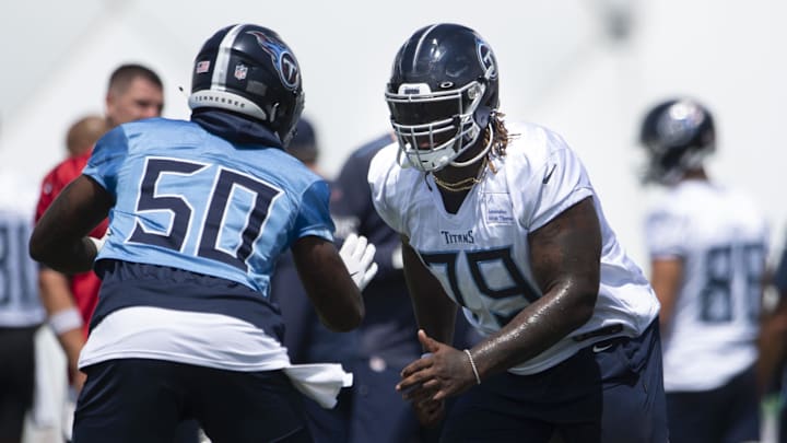 Aug 23, 2020; Nashville, Tennessee, USA;
Tennessee Titans tackle Isaiah Wilson (79) blocks outside linebacker Derick Roberson (50) during a training camp practice at Saint Thomas Sports Park. George Walker IV/ The Tennessean via USA TODAY NETWORK