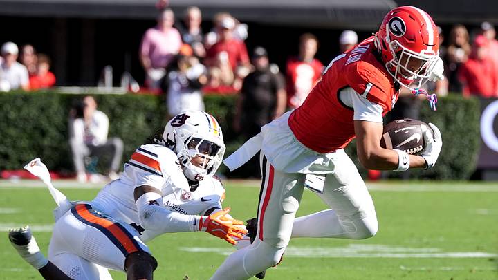 Oct 17, 2026; Athens, Georgia, USA; Georgia wide receiver Talyn Taylor (1) runs for a gain past Auburn defensive back Champ Anthony (1) during the first quarter at Sanford Stadium. Mandatory Credit: Dale Zanine-Imagn Images Oct 17, 2026; Athens, Georgia, USA; Georgia wide receiver Talyn Taylor (1) runs for a gain past Auburn defensive back Champ Anthony (1) during the first quarter at Sanford Stadium. Mandatory Credit: Dale Zanine-Imagn Images
