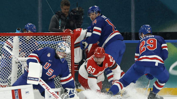 Feb 14, 2026; Milan, Italy; Jeremy Swayman of United States saves a shot from Patrick Russell of Denmark in men's ice hockey group C play during the Milano Cortina 2026 Olympic Winter Games at Milano Santagiulia Ice Hockey Arena. Mandatory Credit: Geoff Burke-Imagn Images Feb 14, 2026; Milan, Italy; Jeremy Swayman of United States saves a shot from Patrick Russell of Denmark in men's ice hockey group C play during the Milano Cortina 2026 Olympic Winter Games at Milano Santagiulia Ice Hockey Arena. Mandatory Credit: Geoff Burke-Imagn Images