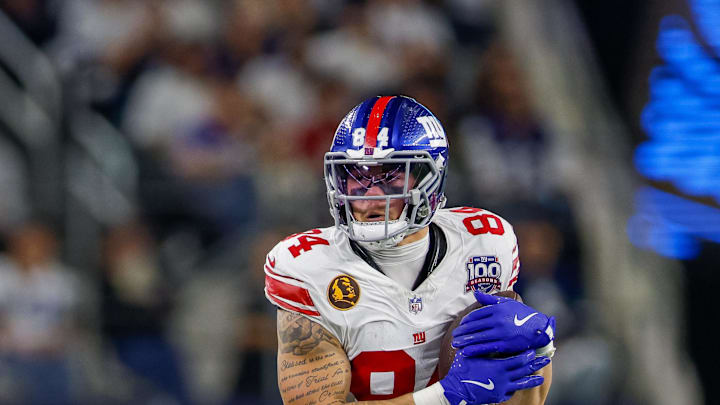 Nov 28, 2024; Arlington, Texas, USA; New York Giants tight end Theo Johnson (84) makes a catch during the third quarter against the Dallas Cowboys at AT&T Stadium.  