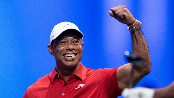 Tiger Woods of Jupiter Links cheers on a teammate during a TGL match against New York Golf Club at SoFi Center on January 13, 2026, in Palm Beach Gardens, Florida. Tiger Woods of Jupiter Links cheers on a teammate during a TGL match against New York Golf Club at SoFi Center on January 13, 2026, in Palm Beach Gardens, Florida.