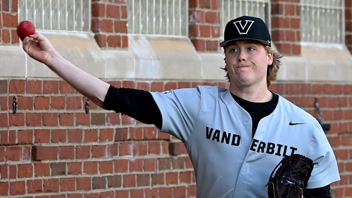 Vanderbilt pitcher Sawyer Hawks warms ups with a weighted ball before a NCAA college baseball game against Tennessee Tech at Hawkins Field Tuesday, Feb. 25, 2025, in Nashville, Tenn.