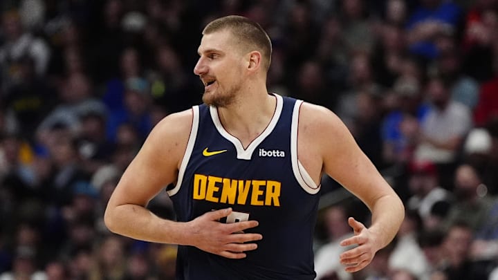 Feb 20, 2025; Denver, Colorado, USA; Denver Nuggets center Nikola Jokic (15) reacts in the first half against the Charlotte Hornets at Ball Arena. Mandatory Credit: Ron Chenoy-Imagn Images