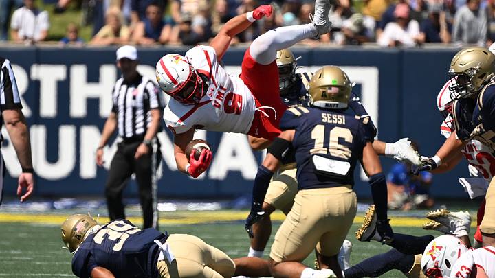 Aug 30, 2025; Annapolis, Maryland, USA; Virginia Military Institute Keydets running back Leo Boehling (9) dives over the top of Navy Midshipmen linebacker Job Grant (39) during the first quarter at Navy-Marine Corps Memorial Stadium. Mandatory Credit: Rafael Suanes-Imagn Images Aug 30, 2025; Annapolis, Maryland, USA; Virginia Military Institute Keydets running back Leo Boehling (9) dives over the top of Navy Midshipmen linebacker Job Grant (39) during the first quarter at Navy-Marine Corps Memorial Stadium. Mandatory Credit: Rafael Suanes-Imagn Images