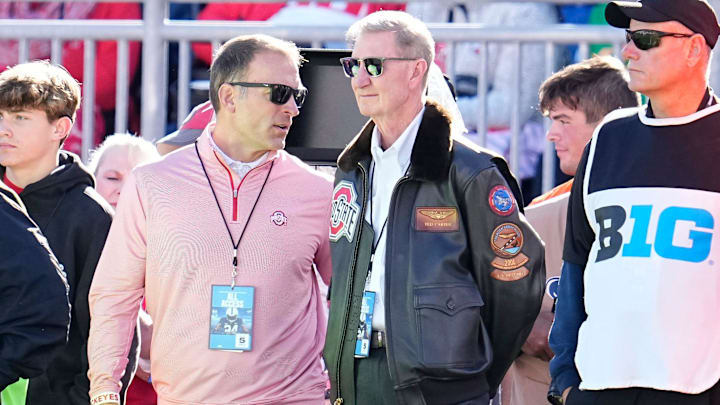 Ohio State athletic director Ross Bjork, left, and president Ted Carter watch on the sideline during the second half of the NCAA football game between the Penn State Nittany Lions and the Ohio State Buckeyes at Beaver Stadium in University Park, Pa. on Saturday, Nov. 2, 2024. Ohio State won 20-13.