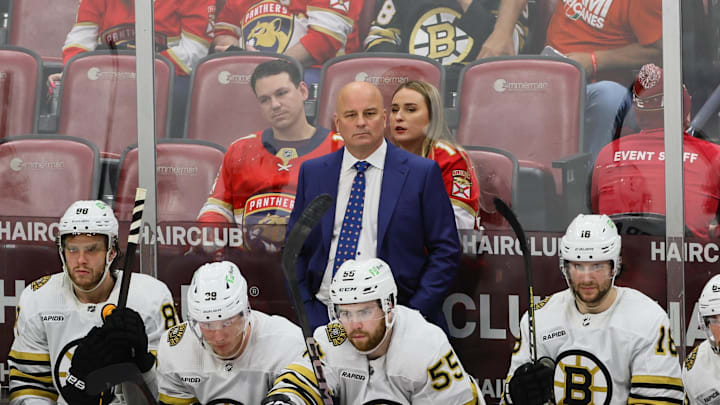May 6, 2024; Sunrise, Florida, USA; Boston Bruins head coach Jim Montgomery watches from the bench against the Florida Panthers during the third period in game one of the second round of the 2024 Stanley Cup Playoffs at Amerant Bank Arena. Mandatory Credit: Sam Navarro-Imagn Images