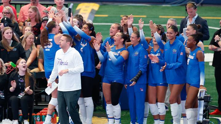 Aug 27, 2026; Arlington, TX, USA;  Florida Gators players celebrate from the sideline during their volleyball match against the Nebraska Cornhuskers at AT&T Stadium.  Mandatory Credit: Chris Jones-Imagn Images
