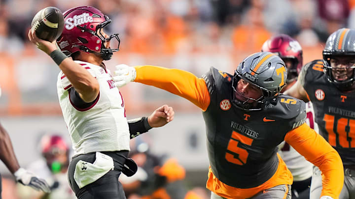 Tennessee defensive lineman Daevin Hobbs (5) pressures New Mexico State quarterback Logan Fife (4) during Tennessee's game against New Mexico State in Neyland Stadium in Knoxville, Tenn., on Nov. 15, 2025.