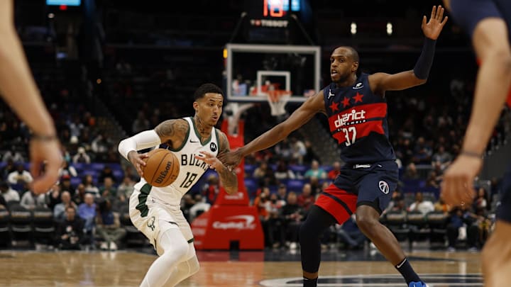 Feb 21, 2025; Washington, District of Columbia, USA; Milwaukee Bucks forward Kyle Kuzma (18) drives to the basket as Washington Wizards forward Khris Middleton (32) defends in the first half at Capital One Arena. Mandatory Credit: Geoff Burke-Imagn Images