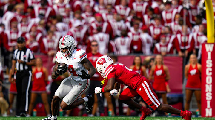 Ohio State Buckeyes wide receiver Jeremiah Smith (4) runs the ball in the first half at Camp Randall Stadium on Saturday, Oct. 18, 2025 in Madison, Wisconsin.