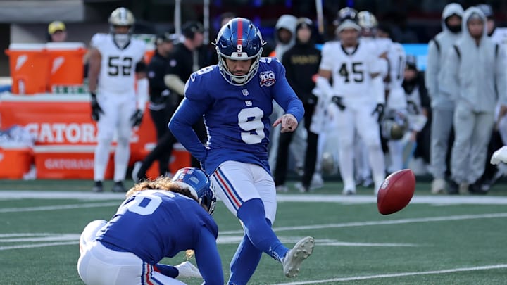 Dec 8, 2024; East Rutherford, New Jersey, USA; New York Giants place kicker Graham Gano (9) kicks a field goal against the New Orleans Saints during the second quarter at MetLife Stadium.  
