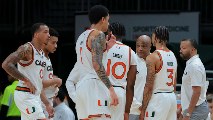 Jan 18, 2025; Coral Gables, Florida, USA; Miami Hurricanes interim head coach Bill Courtney talks to his players against the Southern Methodist Mustangs during the second half at Watsco Center. Mandatory Credit: Sam Navarro-Imagn Images