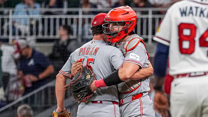 Sep 24, 2026; Cumberland, Georgia, USA; Cincinnati Reds pitcher Emilio Pagan (15) and catcher Tyler Stephenson (37) react after the Reds defeated the Atlanta Braves at Truist Park. Mandatory Credit: Dale Zanine-Imagn Images