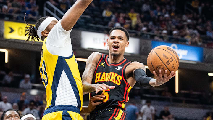Apr 14, 2024; Indianapolis, Indiana, USA; Atlanta Hawks guard Dejounte Murray (5) shoots the ball while Indiana Pacers center Myles Turner (33) defends in the second half at Gainbridge Fieldhouse. Mandatory Credit: Trevor Ruszkowski-USA TODAY Sports