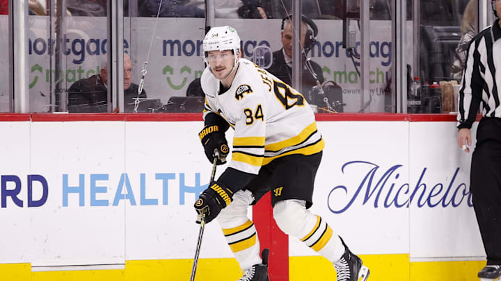 Mar 21, 2026; Detroit, Michigan, USA; Boston Bruins left wing Tanner Jeannot (84) handles the puck during the third period against the Detroit Red Wings at Little Caesars Arena. Mandatory Credit: Brian Bradshaw Sevald-Imagn Images