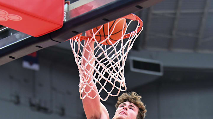 Feb 24, 2024; Syracuse, New York, USA; Notre Dame Fighting Irish guard J.R. Konieczny (20) dunks the