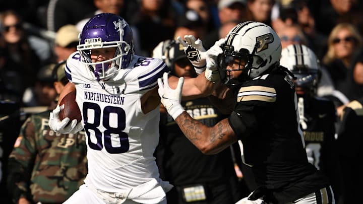 Nov 2, 2024; West Lafayette, Indiana, USA; Northwestern Wildcats tight end Marshall Lang (88) pushes away Purdue Boilermakers defensive back Antonio Stevens (11) during the second quarter at Ross-Ade Stadium. Mandatory Credit: Marc Lebryk-Imagn Images Nov 2, 2024; West Lafayette, Indiana, USA; Northwestern Wildcats tight end Marshall Lang (88) pushes away Purdue Boilermakers defensive back Antonio Stevens (11) during the second quarter at Ross-Ade Stadium. Mandatory Credit: Marc Lebryk-Imagn Images