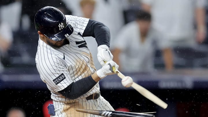 Jun 16, 2025; Bronx, New York, USA; New York Yankees left fielder Jasson Dominguez (24) breaks his bat hitting into a fielder's choice ground ball out during the eleventh inning against the Los Angeles Angels at Yankee Stadium. Mandatory Credit: Brad Penner-Imagn Images