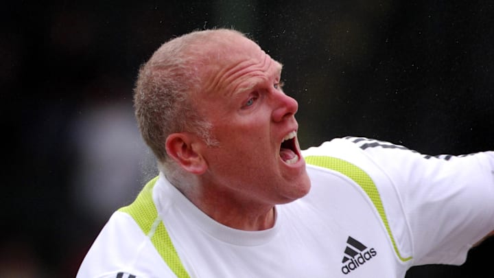 Olympic gold medalist John Godina competes in the shot put during a track and field meet at Hayward Field in Eugene, Ore., on May 27, 2007.