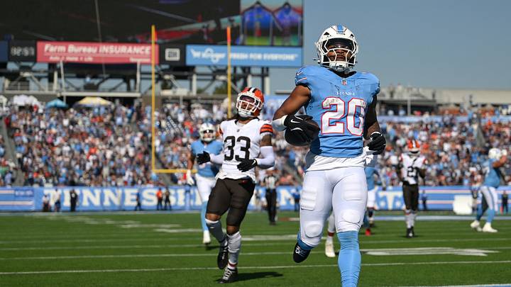 Oct 25, 2026; Nashville, Tennessee, USA;  Tennessee Titans running back Tony Pollard (20) runs for a thirty-six yard touchdown against Cleveland Browns safety Ronnie Hickman (33) during the first quarter at Nissan Stadium.  Mandatory Credit: Steve Roberts-Imagn Images