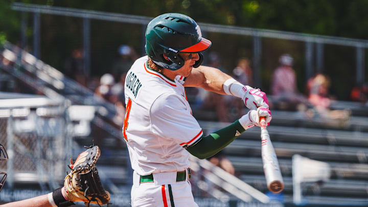 Miami's shortstop Jake Ogden smashing a homerun against UConn