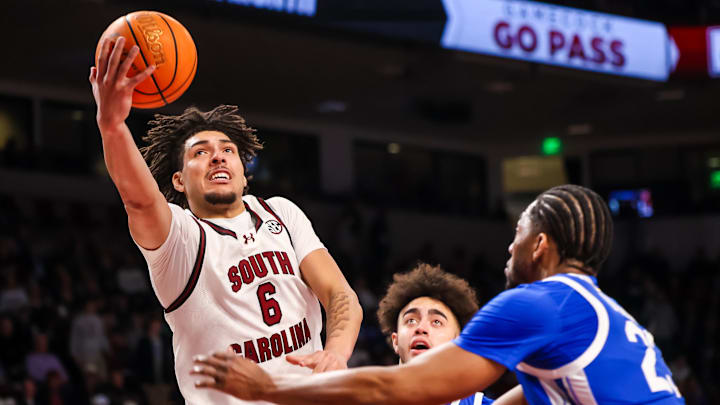 Feb 24, 2026; Columbia, South Carolina, USA; South Carolina Gamecocks forward EJ Walker (6) drives past Kentucky Wildcats forward Mouhamed Dioubate (23) during the first half at Colonial Life Arena. Mandatory Credit: Jeff Blake-Imagn Images