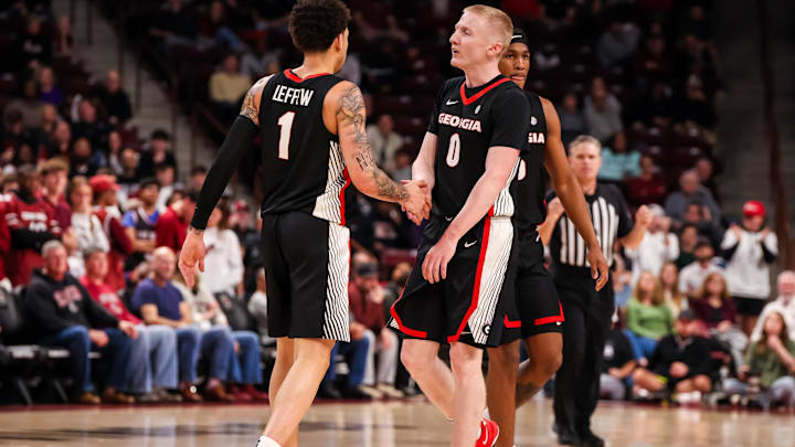 Mar 4, 2025; Columbia, South Carolina, USA; Georgia Bulldogs guard Blue Cain (0) and guard Dakota Leffew (1) celebrate a three point basket against the South Carolina Gamecocks in the second half at Colonial Life Arena. Mandatory Credit: Jeff Blake-Imagn Images