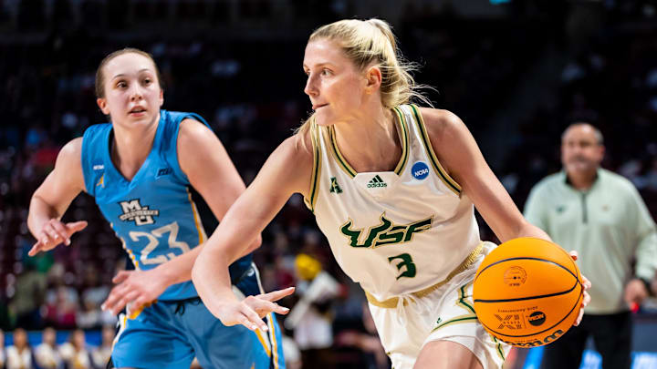 Mar 17, 2023; Columbia, South Carolina, USA; South Florida Bulls guard Sammie Puisis (3) drives around Marquette Golden Eagles guard Jordan King (23) in the second half of their first round matchup in the 2023 NCAA Division 1 Women   s Basketball Tournament  at Colonial Life Arena. South Florida won 67-65. Mandatory Credit: Jeff Blake-Imagn Images