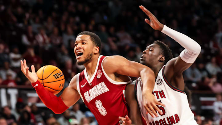 Jan 8, 2025; Columbia, South Carolina, USA; Alabama Crimson Tide guard Chris Youngblood (8) loses the ball as South Carolina Gamecocks guard Morris Ugusuk (15) defends in the second half at Colonial Life Arena. Mandatory Credit: Jeff Blake-Imagn Images
