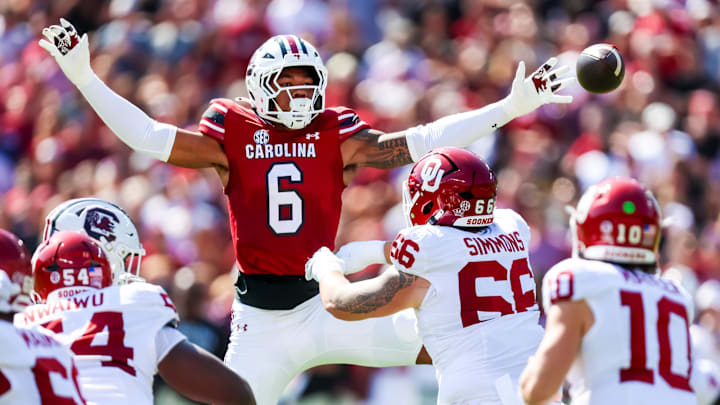 Oct 18, 2025; Columbia, South Carolina, USA; South Carolina Gamecocks defensive end Dylan Stewart (6) attempt to knock down a pass by Oklahoma Sooners quarterback John Mateer (10) in the first quarter at Williams-Brice Stadium. Mandatory Credit: Jeff Blake-Imagn Images