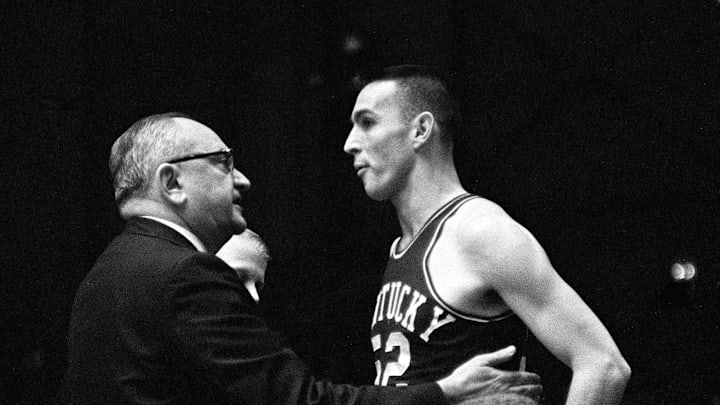 Kentucky head coach Adolph Rupp, left, talks with one of his players before sending him into the game against Vanderbilt Jan. 9, 1961. The Wildcats became the Commodores' 11th straight victim, falling 64-62 before 7,324 fans at Memorial Gym.

Title Sec Basketball