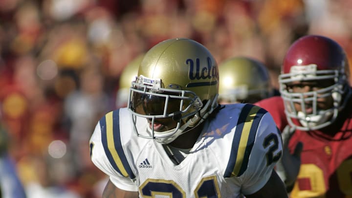 Dec 3, 2005; Los Angeles, CA, USA; FILE PHOTO; UCLA Bruins running back Maurice Jones-Drew (21) carries the ball against the Southern California Trojans at the Los Angeles Memorial Coliseum. Mandatory Credit: Peter Brouillet-USA TODAY Sports
