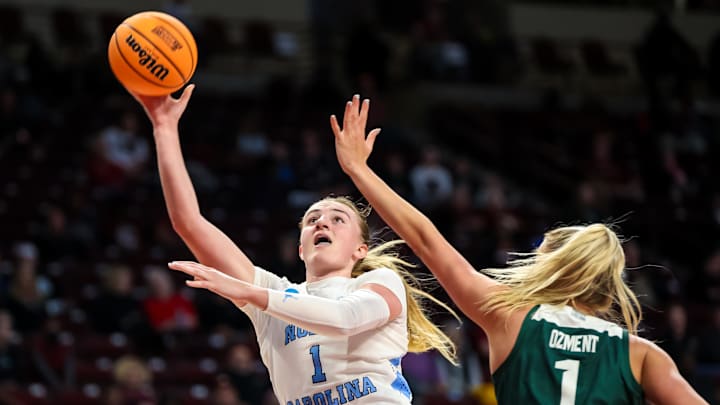 Mar 22, 2024; Columbia, SC, USA; North Carolina Tar Heels guard Alyssa Ustby (1) shoots over Michigan State Spartans guard Tory Ozment (1) in the first half at Colonial Life Arena. Mandatory Credit: Jeff Blake-Imagn Images