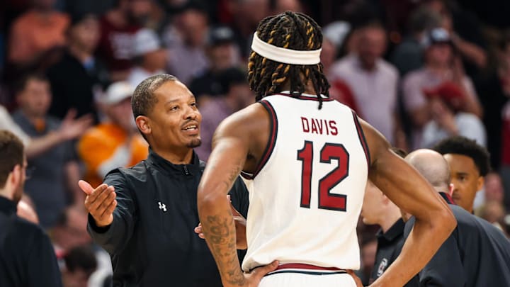 South Carolina basketball coach Lamont Paris coaching up wing Zach Davis, who will be rocking a new number this season
