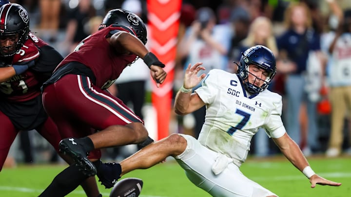 South Carolina football EDGE Dylan Stewart knocking the ball away from Old Dominion quarterback Grant Wilson on Saturday.