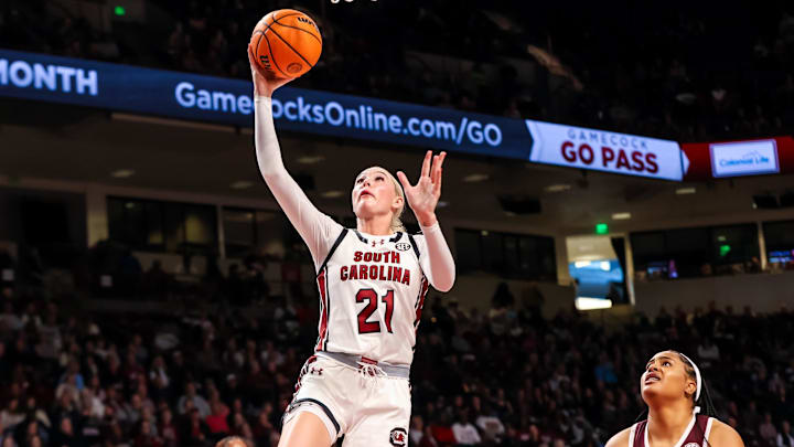Jan 9, 2025; Columbia, South Carolina, USA; South Carolina Gamecocks forward Chloe Kitts (21) drives past Texas A&M Aggies forward Jada Malone (13) in the first half at Colonial Life Arena. Mandatory Credit: Jeff Blake-Imagn Images