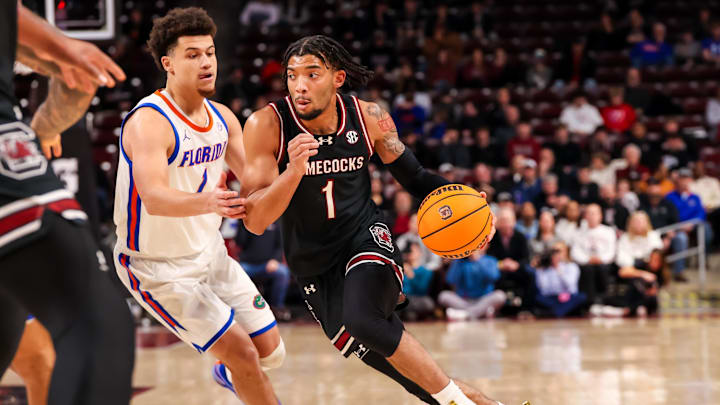 Jan 22, 2025; Columbia, South Carolina, USA; South Carolina Gamecocks guard Jacobi Wright (1) drives around Florida Gators guard Walter Clayton Jr. (1) in the first half at Colonial Life Arena. Mandatory Credit: Jeff Blake-Imagn Images