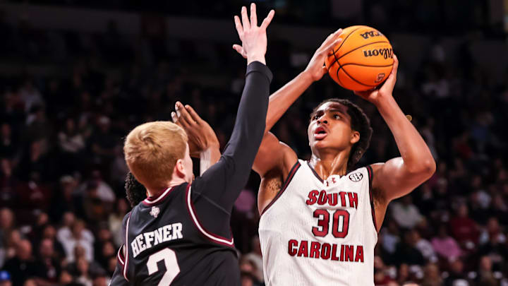Feb 1, 2025; Columbia, South Carolina, USA; South Carolina Gamecocks forward Collin Murray-Boyles (30) shoots over Texas A&M Aggies guard Hayden Hefner (2) in the first half at Colonial Life Arena. Mandatory Credit: Jeff Blake-Imagn Images