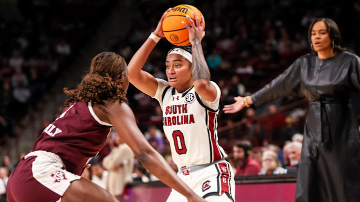 Jan 9, 2025; Columbia, South Carolina, USA; South Carolina Gamecocks guard Te-Hina Paopao (0) looks to pass over Texas A&M Aggies guard Aicha Coulibaly (5) in the first half at Colonial Life Arena. Mandatory Credit: Jeff Blake-Imagn Images