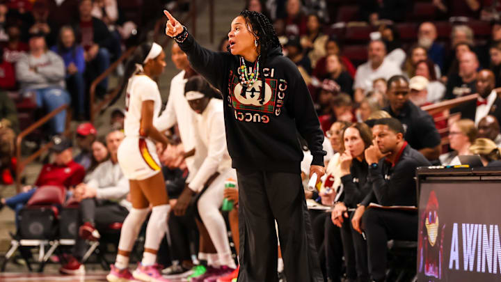Dec 29, 2024; Columbia, South Carolina, USA; South Carolina Gamecocks head coach Dawn Staley directs her team against the Wofford Terriers in the first half at Colonial Life Arena. Mandatory Credit: Jeff Blake-Imagn Images