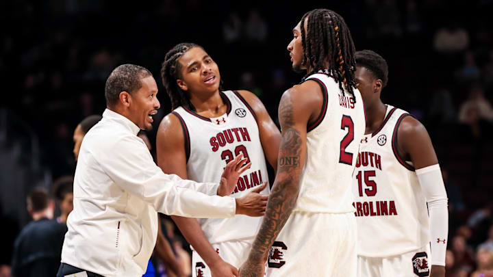 Dec 30, 2024; Columbia, South Carolina, USA; South Carolina Gamecocks head coach Lamont Paris speaks with forward Collin Murray-Boyles (30), guard Zachary Davis (2), and guard Morris Ugusuk (15) against the Presbyterian Blue Hose in the second half at Colonial Life Arena. Mandatory Credit: Jeff Blake-Imagn Images
