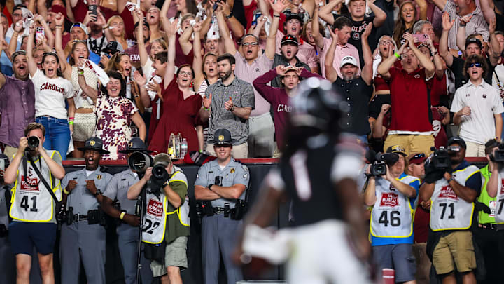 Sep 27, 2025; Columbia, South Carolina, USA; South Carolina Gamecocks fans celebrate a touchdown against the Kentucky Wildcats in the first quarter at Williams-Brice Stadium. Mandatory Credit: Jeff Blake-Imagn Images Sep 27, 2025; Columbia, South Carolina, USA; South Carolina Gamecocks fans celebrate a touchdown against the Kentucky Wildcats in the first quarter at Williams-Brice Stadium. Mandatory Credit: Jeff Blake-Imagn Images