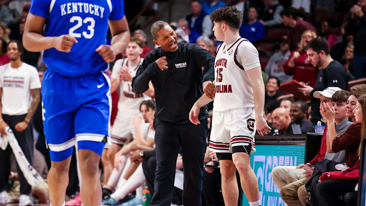 Feb 24, 2026; Columbia, South Carolina, USA; South Carolina Gamecocks head coach Lamont Paris speaks with guard Eli Ellis (15) against the Kentucky Wildcats during the second half at Colonial Life Arena. Mandatory Credit: Jeff Blake-Imagn Images
